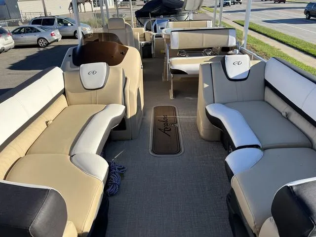 Slide: The Image of 2023 Avalon Catalina Entertainer Funship 25 FT interior with beige and black seating. - 7