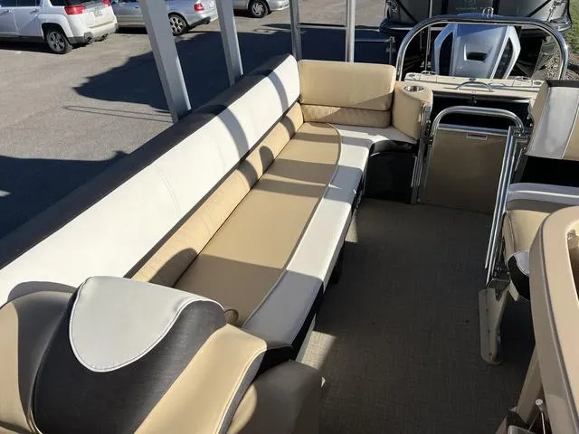 Slide: The Image of 2023 Avalon Catalina Entertainer Funship 25 FT interior seating area with beige and white upholstery. - 8