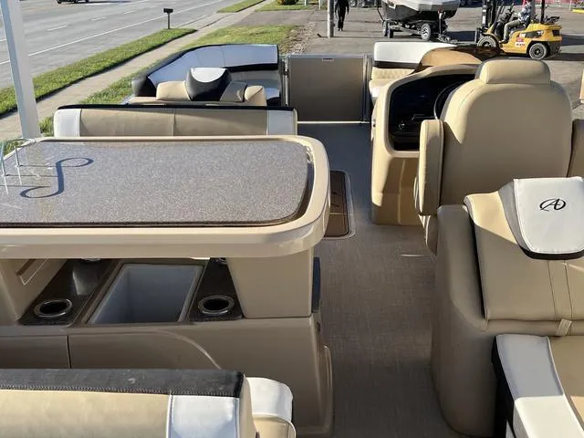 Slide: The Image of 2023 Avalon Catalina Entertainer Funship 25 FT interior with seating and table. - 9