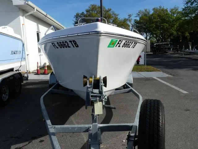 Slide: The Image of 2021 Key Largo 1800C boat on trailer, parked outdoors. - 2