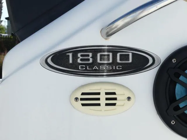 Slide: The Image of 2021 Key Largo 1800C boat on a trailer with Suzuki outboard motor. - 5