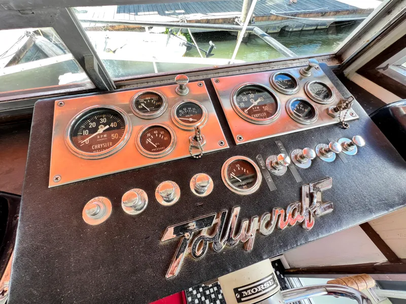 Slide: The Image of 1970 Tollycraft Tollyhome 36 dashboard with vintage gauges and controls. - 24