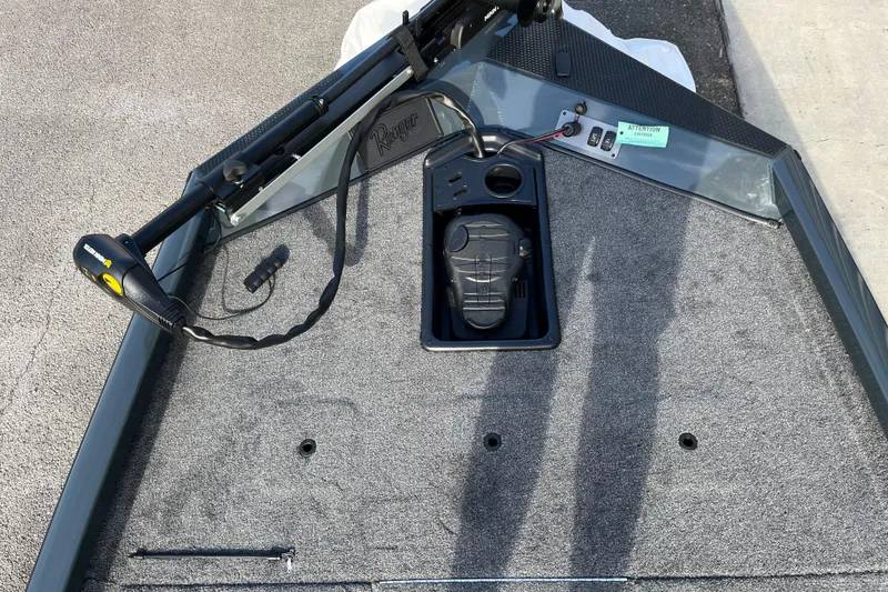 Slide: The Image of 2024 Ranger RT188 boat deck with trolling motor and foot pedal. - 2