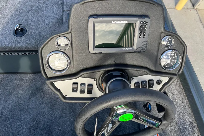 Slide: The Image of 2024 Ranger RT188 boat dashboard with Lowrance fishfinder and steering wheel. - 7