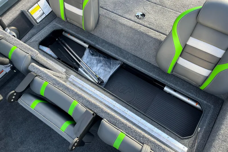 Slide: The Image of 2024 Ranger RT188 boat interior storage compartment with green and gray seats. - 8