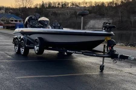 Slide: The Image of 2024 Ranger Z521R Ranger Cup Equipped boat on trailer by lakeside at sunset. - 7
