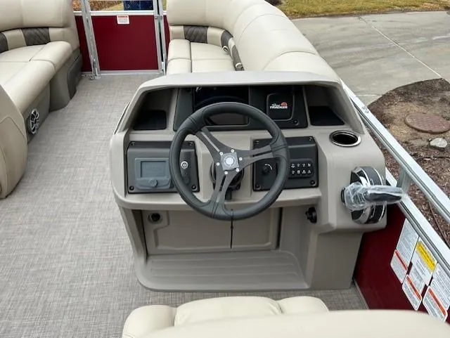 Slide: The Image of 2024 Sun Tracker Party Barge 20 DLX pontoon boat helm with steering wheel and control panel. - 5
