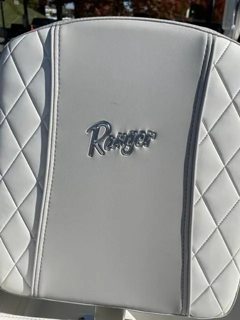 Slide: The Image of 2024 Ranger 2660 Bay boat seat with diamond-stitched white upholstery. - 8
