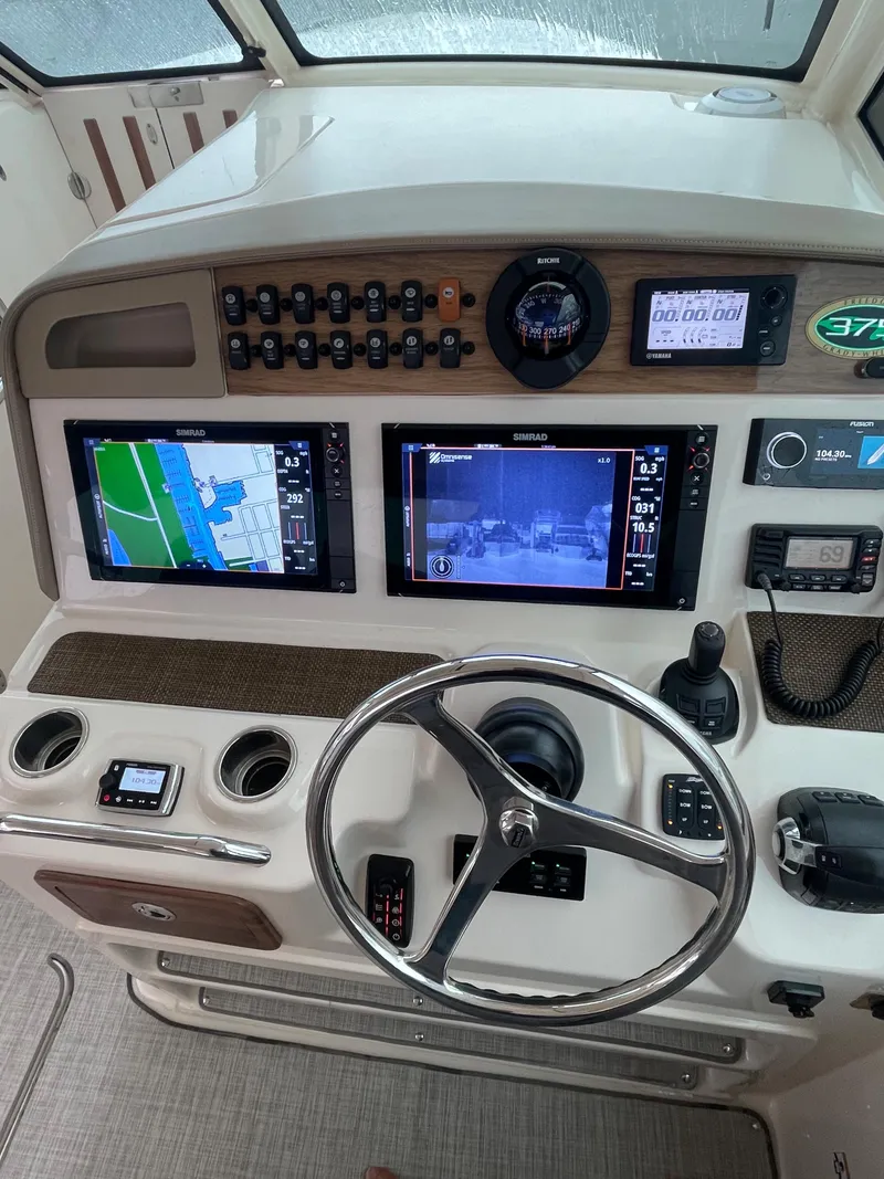 Slide: The Image of 2014 Grady-White Freedom 375 helm with navigation screens and controls. - 3