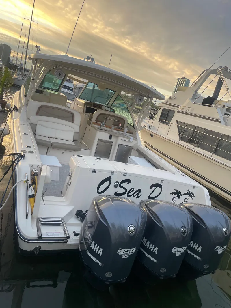 Slide: The Image of 2014 Grady-White Freedom 375 boat docked with triple Yamaha engines. - 6