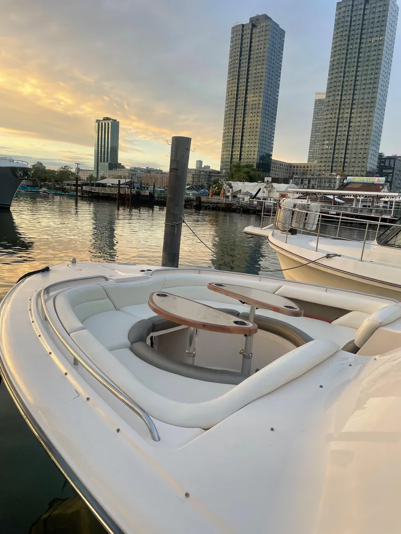 Slide: The Image of 2014 Grady-White Freedom 375 boat docked with city skyline in background. - 7