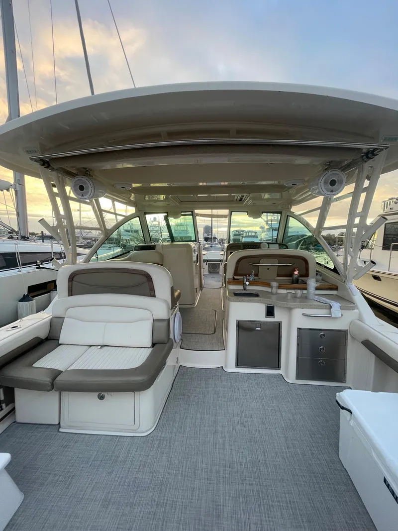 Slide: The Image of 2014 Grady-White Freedom 375 boat interior with seating and helm station. - 8