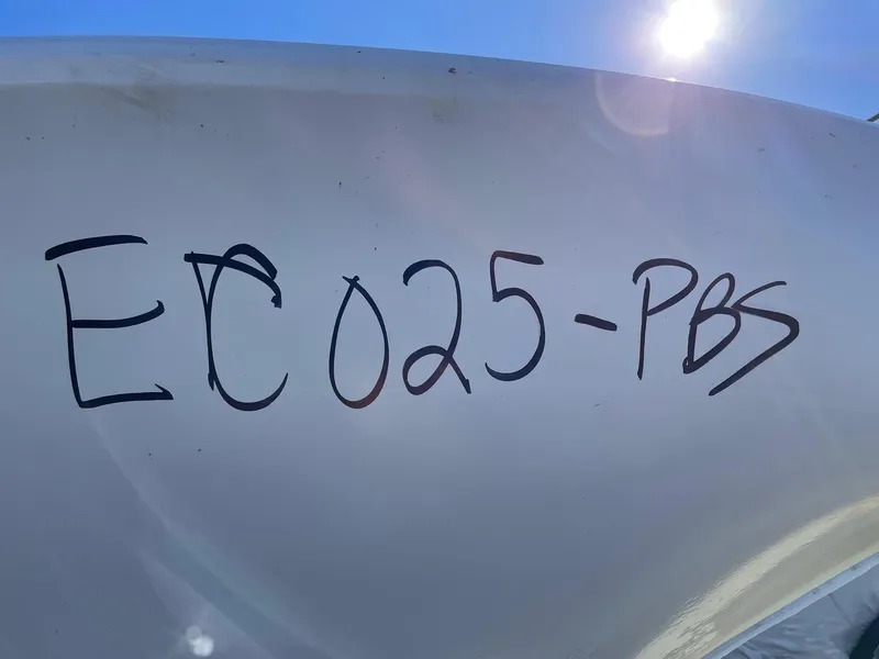 Slide: The Image of 2024 Cobia 262 Center Console boat with twin 200 HP engines. - 10