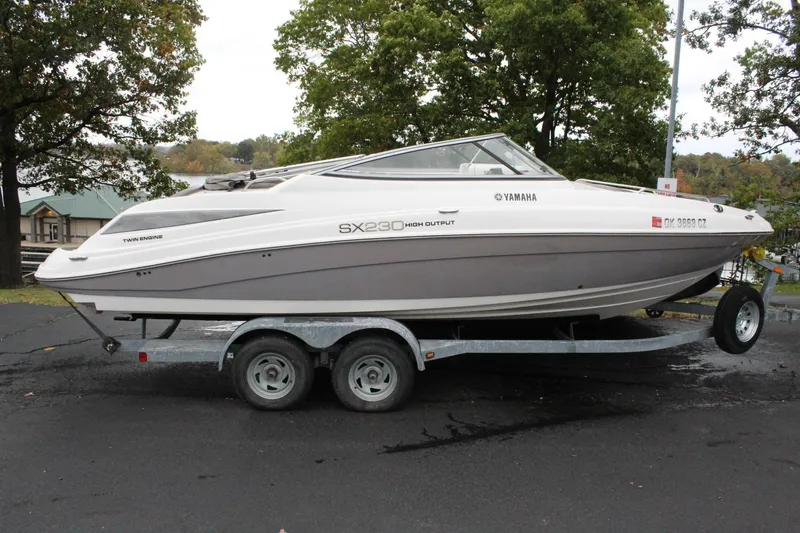 Slide: The Image of 2007 Yamaha Boats 230sx on a trailer, parked outdoors. - 0