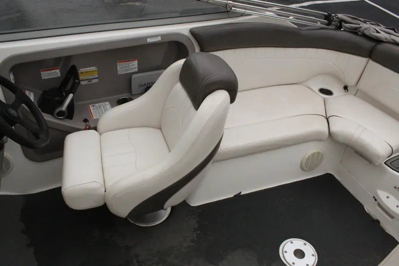 Slide: The Image of 2007 Yamaha Boats 230sx interior with white and gray seating. - 11