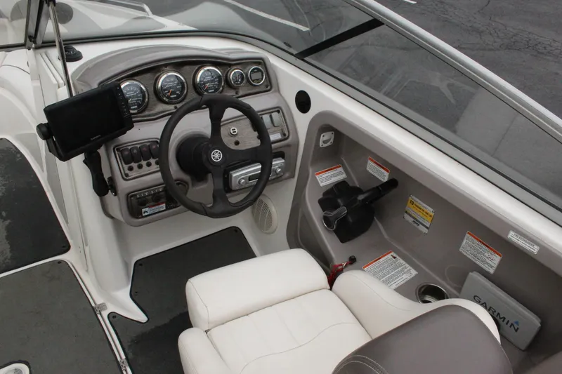 Slide: The Image of 2007 Yamaha Boats 230sx cockpit with steering wheel, gauges, and control panel. - 6