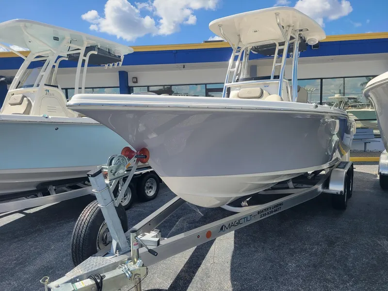 The Image of 2024 Key West 239 FS boat on a trailer in a dealership lot. - 0