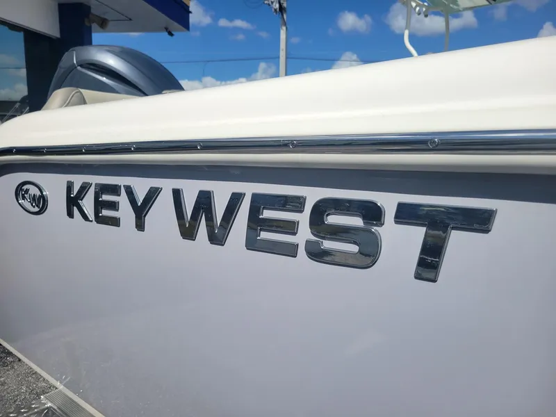 Slide: The Image of 2024 Key West 239 FS boat side view with logo. - 23