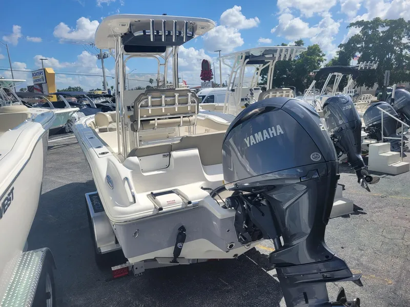 Slide: The Image of 2024 Key West 239 FS boat with Yamaha outboard motor in a marina. - 3