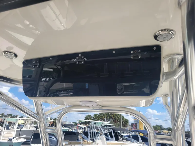 Slide: The Image of 2024 Key West 239 FS boat console with electronics and overhead storage. - 9