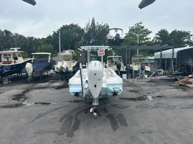 Slide: The Image of 2024 Caymas 26 HB boat for sale in a parking lot. - 17