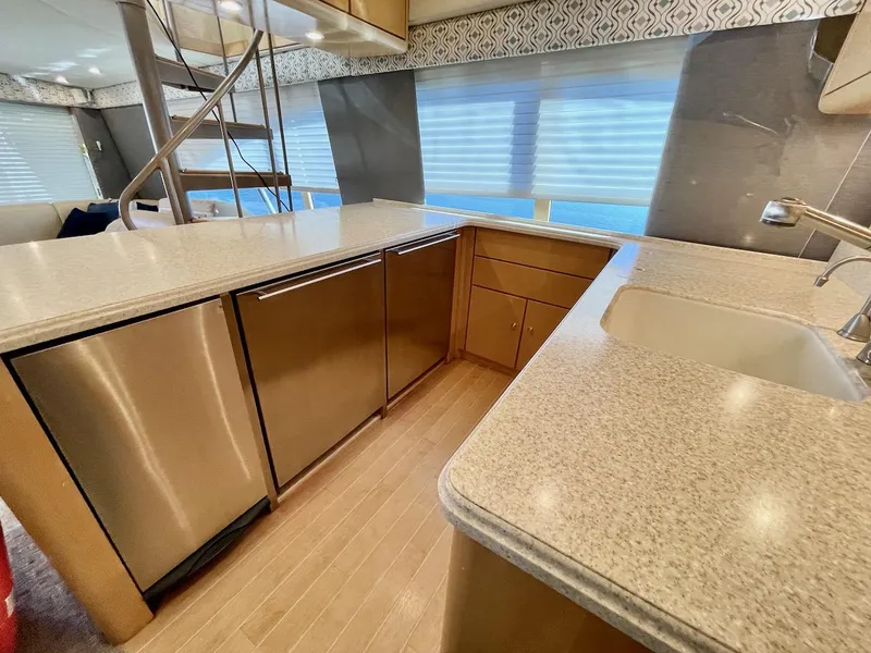 Slide: The Image of Modern kitchen area in a 2003 Ocean Yachts 62 Convertible boat. - 10