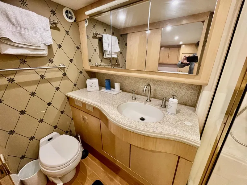 Slide: The Image of Bathroom interior of a 2003 Ocean Yachts 62 Convertible with modern fixtures and ample storage. - 26