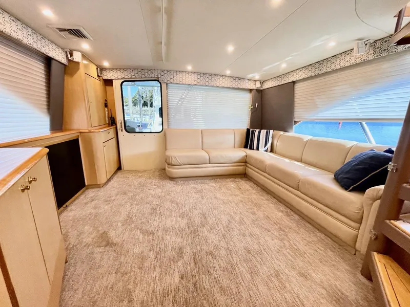Slide: The Image of Spacious interior of 2003 Ocean Yachts 62 Convertible with beige leather seating. - 3