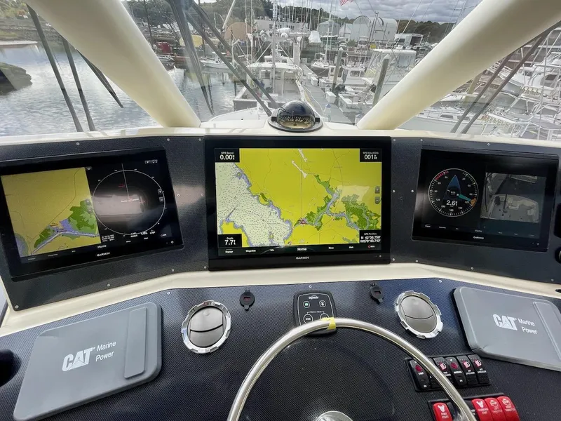 Slide: The Image of Dashboard of a 2003 Ocean Yachts 62 Convertible with navigation screens. - 32