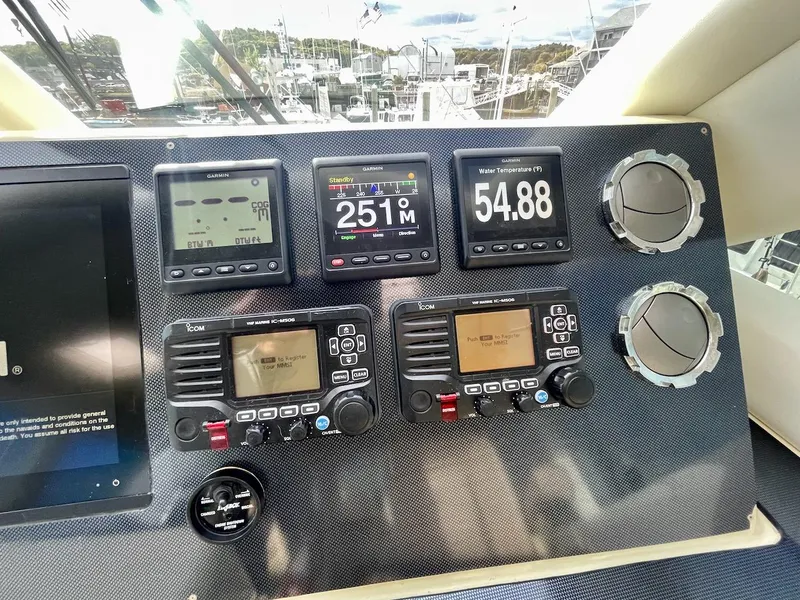Slide: The Image of Control panel of a 2003 Ocean Yachts 62 Convertible with navigation instruments. - 33