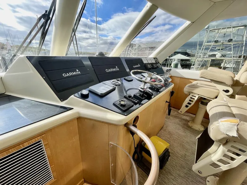 Slide: The Image of Helm station of 2003 Ocean Yachts 62 Convertible with Garmin navigation systems. - 36