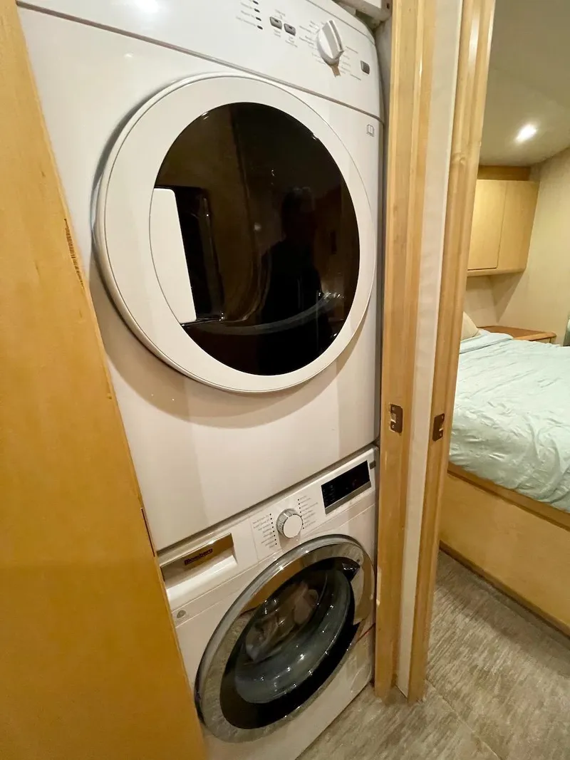Slide: The Image of Stacked washer and dryer in 2003 Ocean Yachts 62 Convertible interior. - 37