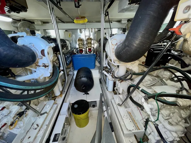 Slide: The Image of Engine room of a 2003 Ocean Yachts 62 Convertible with various mechanical components. - 39