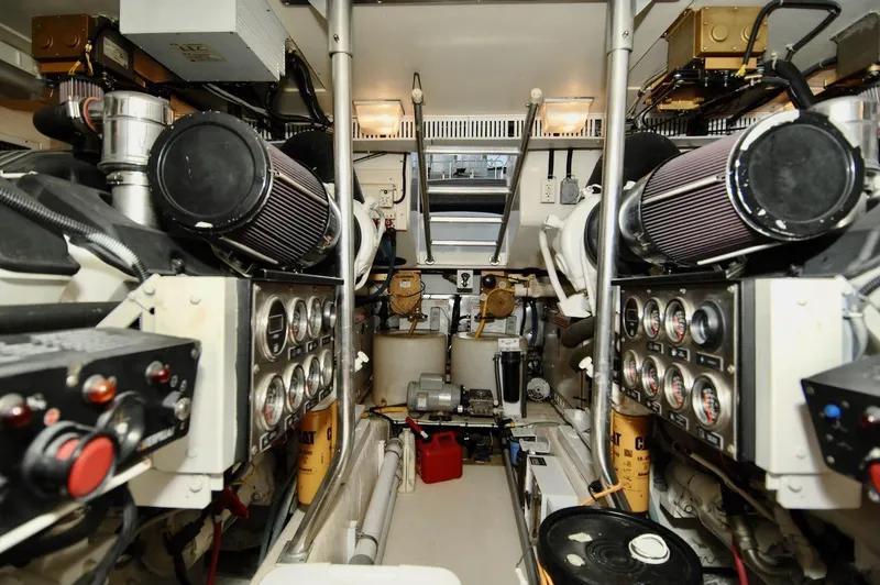 Slide: The Image of Engine room of a 2003 Ocean Yachts 62 Convertible with dual engines and control panels. - 41