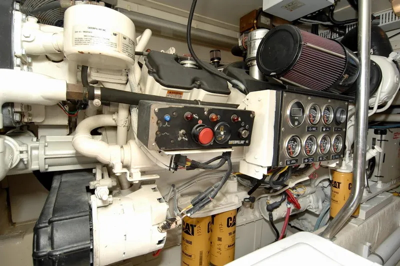 Slide: The Image of Engine room of a 2003 Ocean Yachts 62 Convertible with control panel and gauges. - 43
