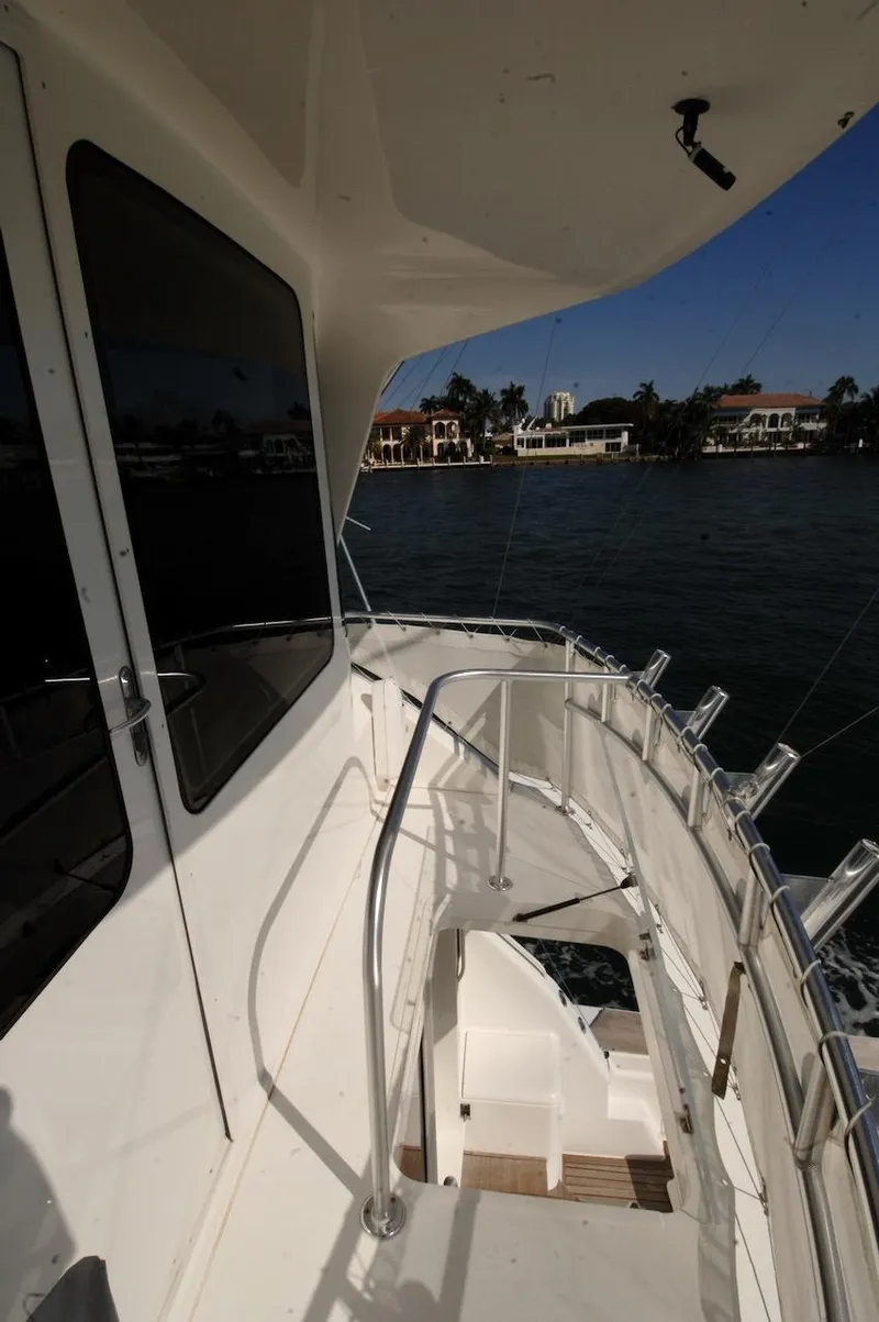 Slide: The Image of 2003 Ocean Yachts 62 Convertible yacht deck with waterfront view. - 49