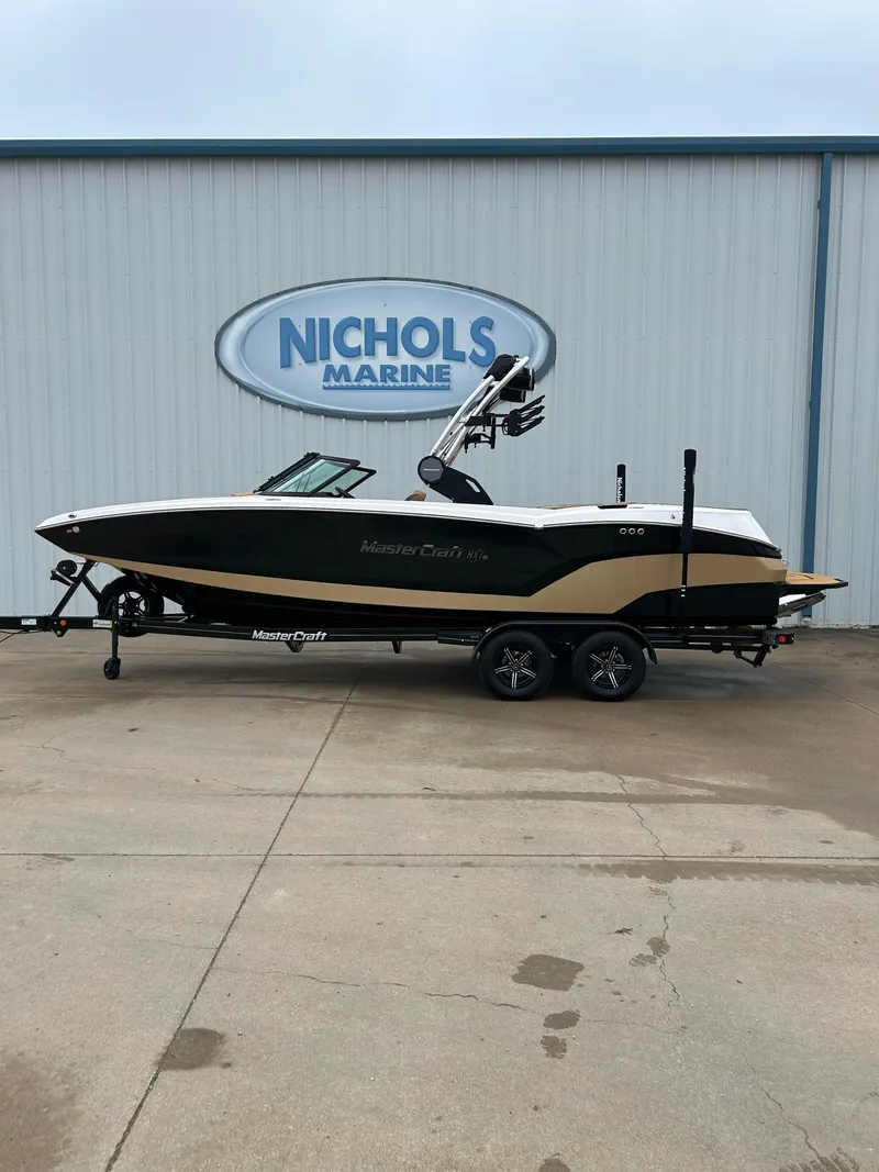 Slide: The Image of 2024 MasterCraft NXT 24 boat on trailer at Nichols Marine. - 1