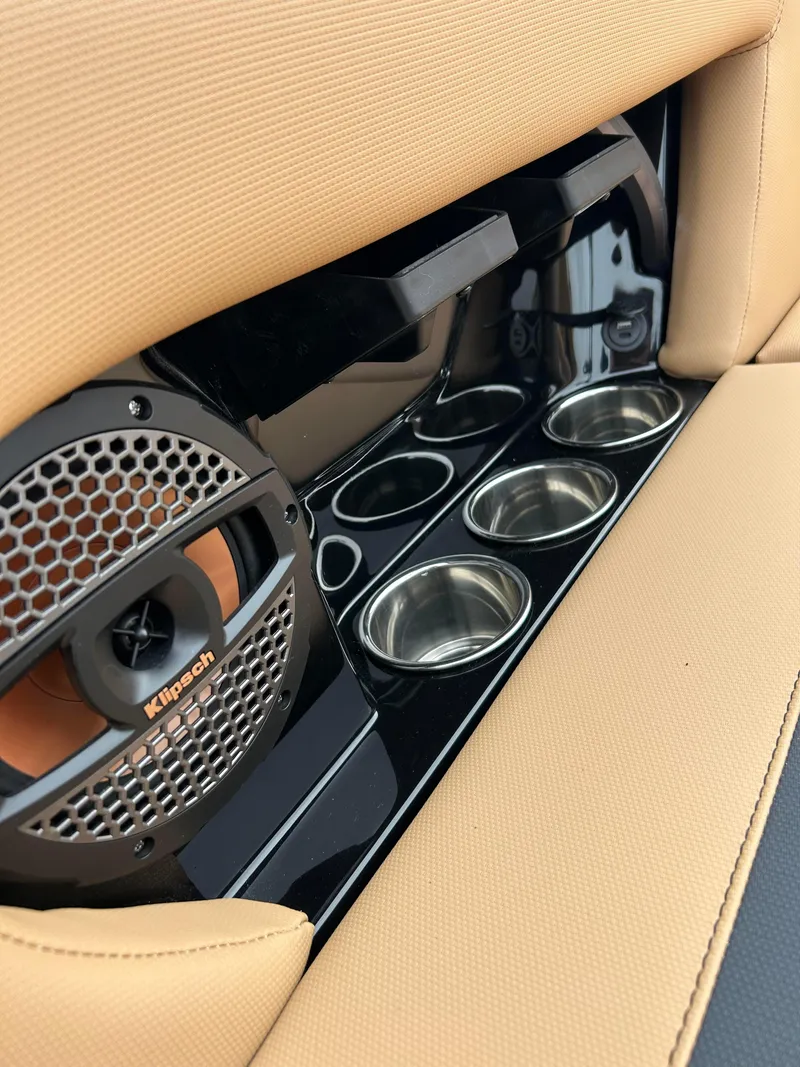 Slide: The Image of 2024 MasterCraft NXT 24 boat interior with speaker and cup holders. - 13