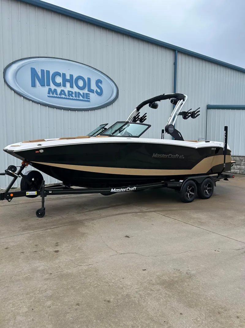 Slide: The Image of 2024 MasterCraft NXT 24 boat at Nichols Marine dealership. - 3