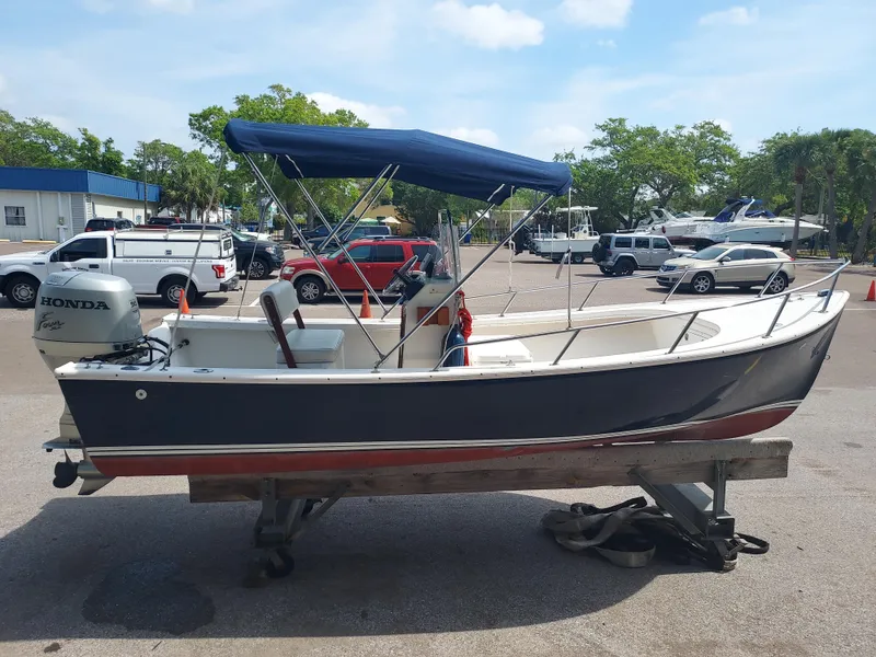 The Image of 2000 Eastern 19 Center Console boat with Honda outboard motor on trailer. - 0