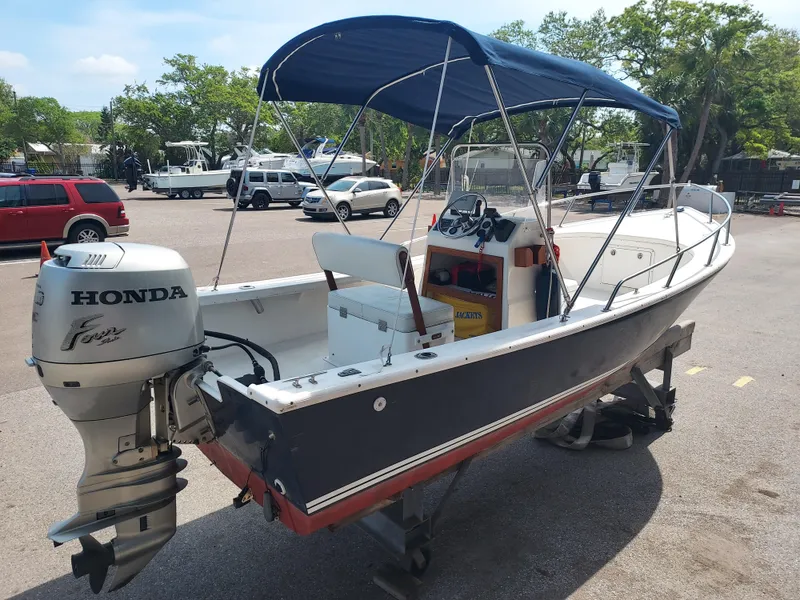 Slide: The Image of 2000 Eastern 19 Center Console boat with Honda outboard motor. - 20