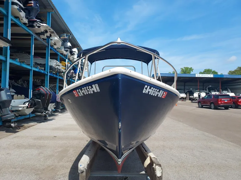 Slide: The Image of 2000 Eastern 19 Center Console boat in marina storage. - 22