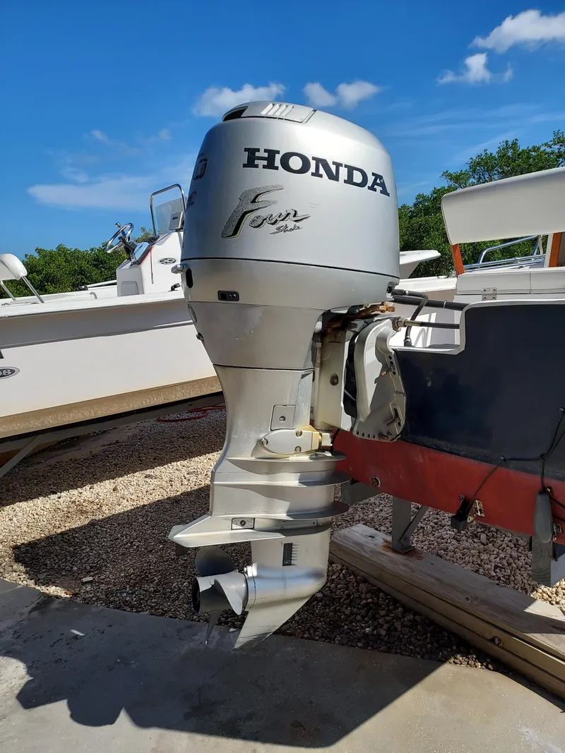 Slide: The Image of Honda outboard motor on a 2000 Eastern 19 Center Console boat. - 3