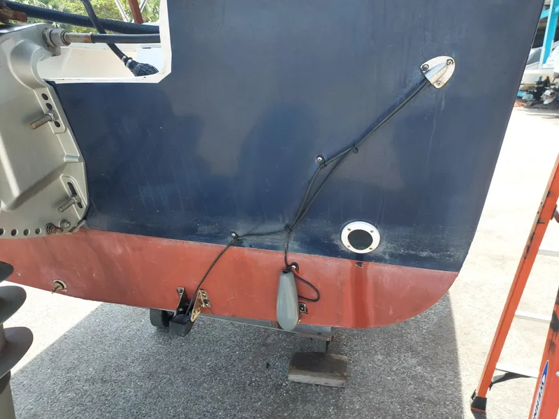 Slide: The Image of Close-up of the stern of a 2000 Eastern 19 Center Console boat. - 30