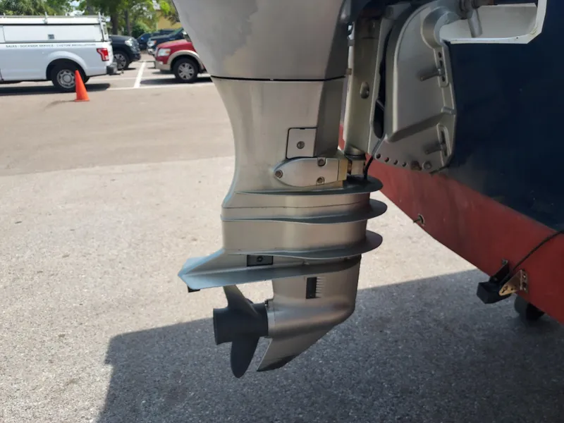 Slide: The Image of Close-up of the outboard motor on a 2000 Eastern 19 Center Console boat. - 32