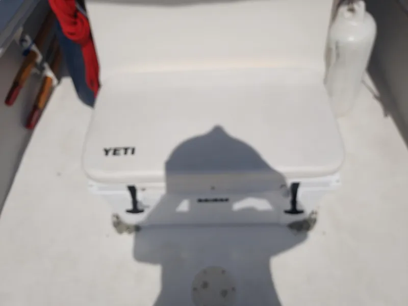 Slide: The Image of YETI cooler on a 2000 Eastern 19 Center Console boat deck. - 41