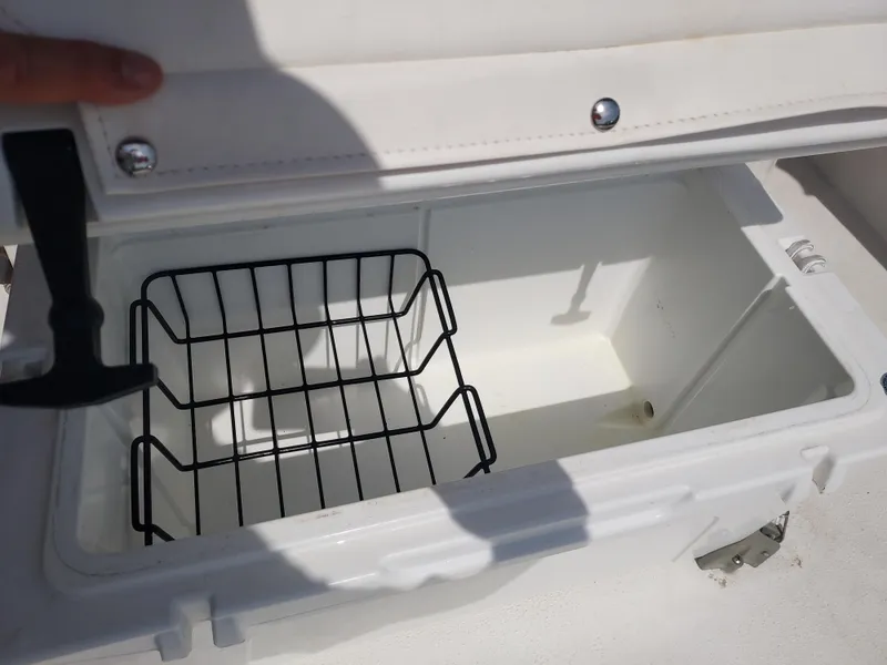 Slide: The Image of Open storage compartment on a 2000 Eastern 19 Center Console boat. - 42