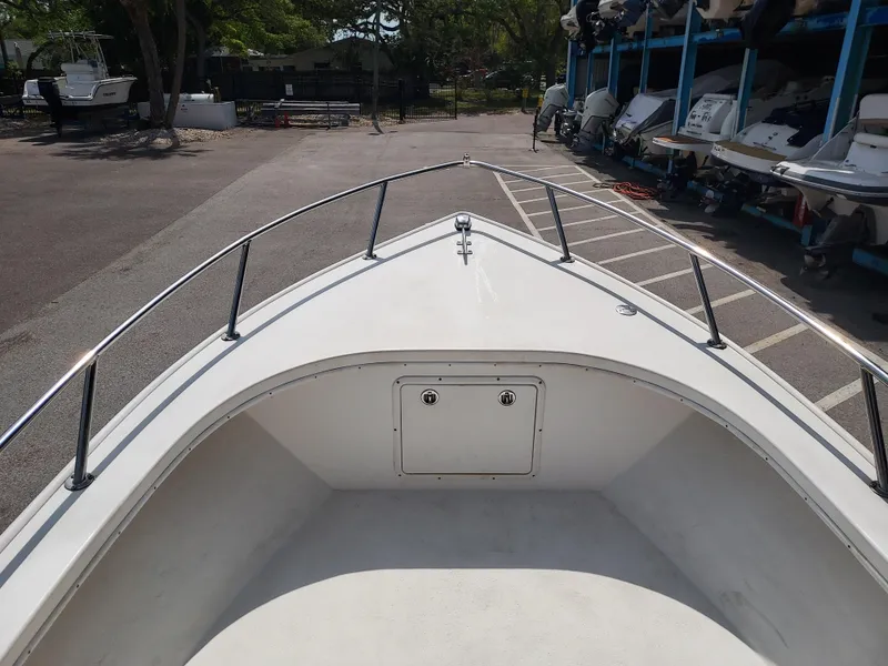 Slide: The Image of Bow of a 2000 Eastern 19 Center Console boat in a marina. - 43