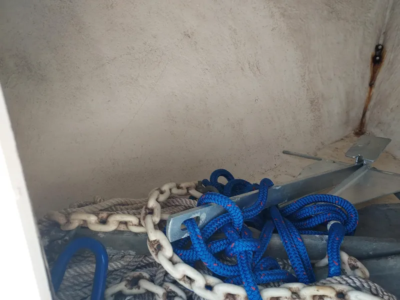 Slide: The Image of Anchor and ropes in storage compartment of 2000 Eastern 19 Center Console boat. - 48