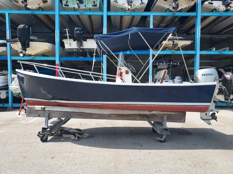Slide: The Image of 2000 Eastern 19 Center Console boat on a trailer in a storage facility. - 24